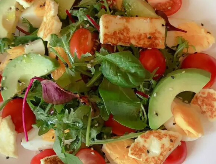 Salad with avocado and fried cheese
